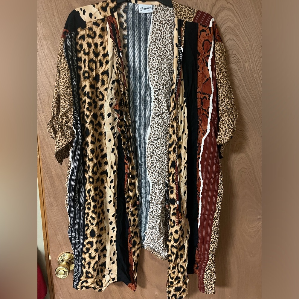 Mixed print shaw w/tassels buttons on the front